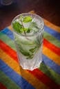 A refreshing mojito cocktail with fresh mint and ice cubes, perfect for summer refreshment.